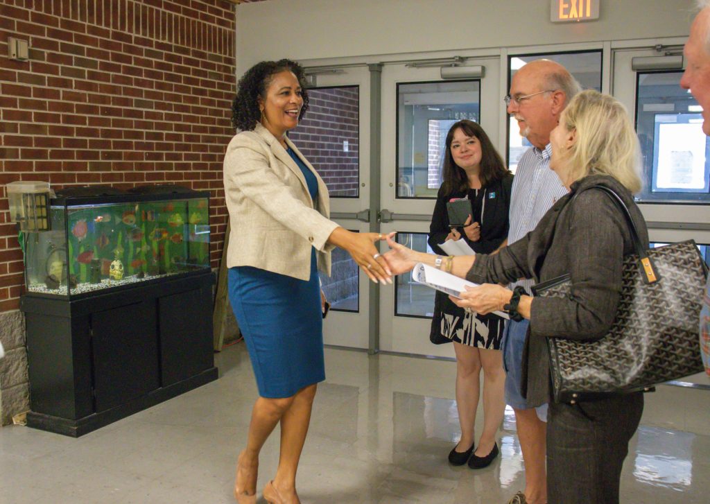 Dr. Stewart shakes hands