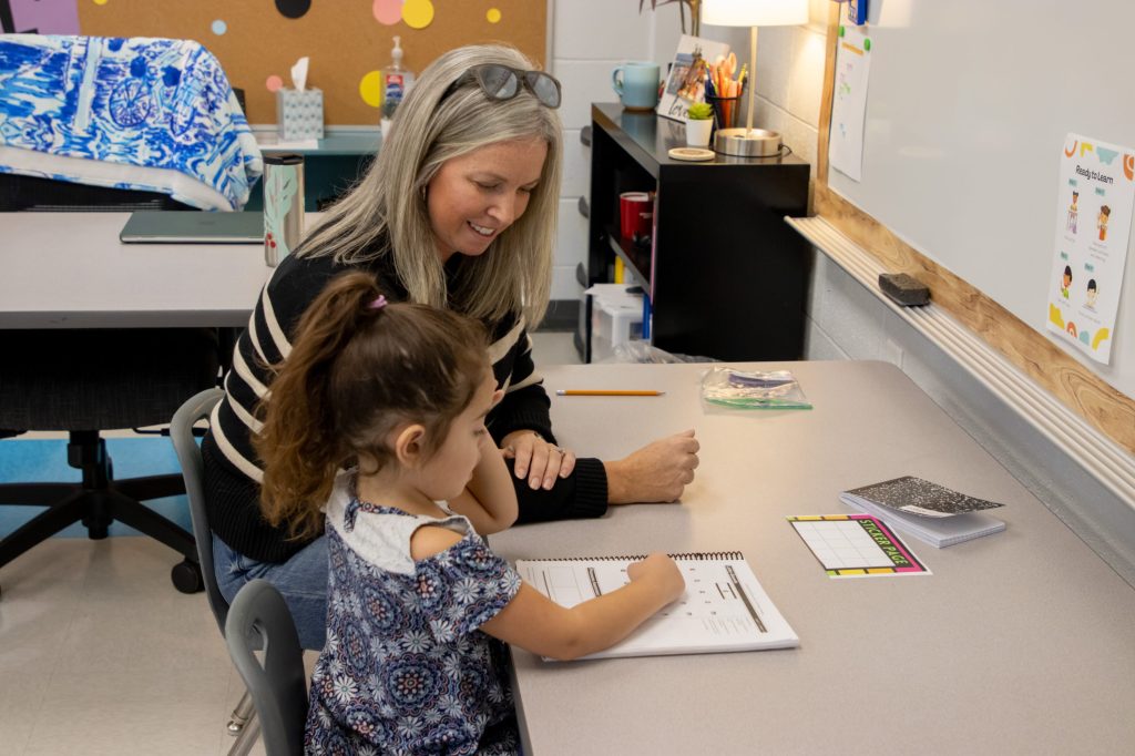 Literacy First Edit-11 A teacher works with a student