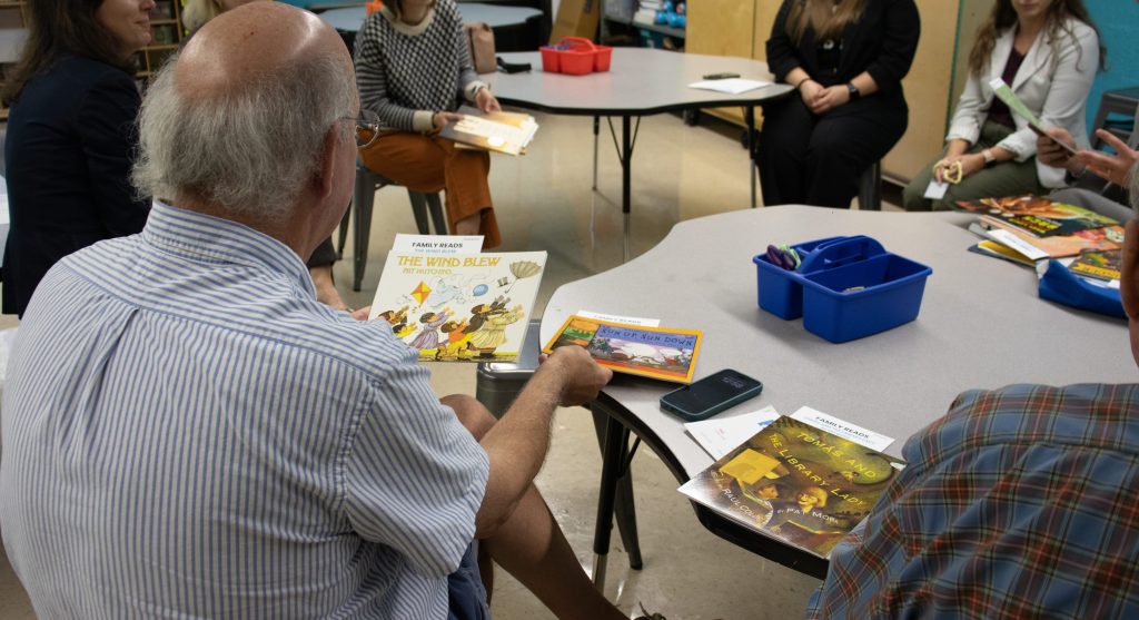 A man looks through books