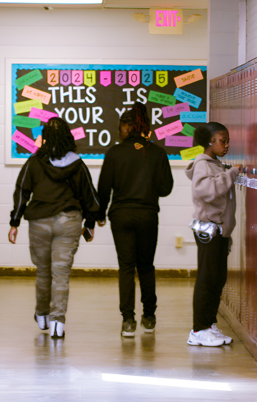 Day in the Life-6 student using locker and students walking to class