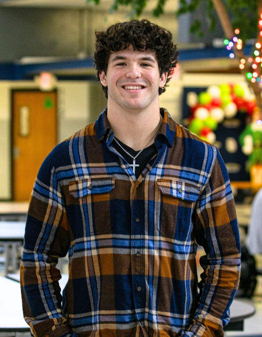 A student poses for a photo