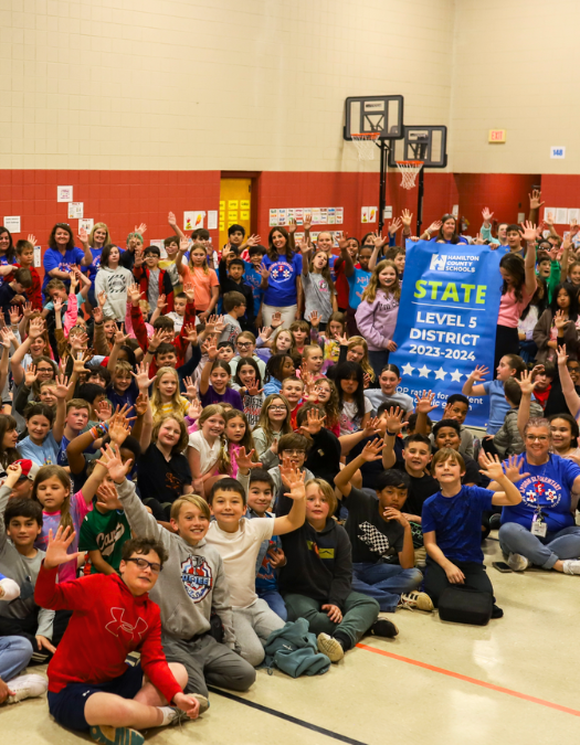 Students pose for a banner presentation photo