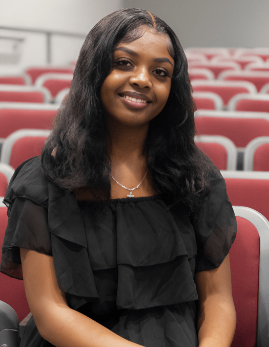 A student poses for a photo