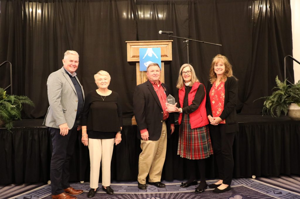 A group poses for a photo