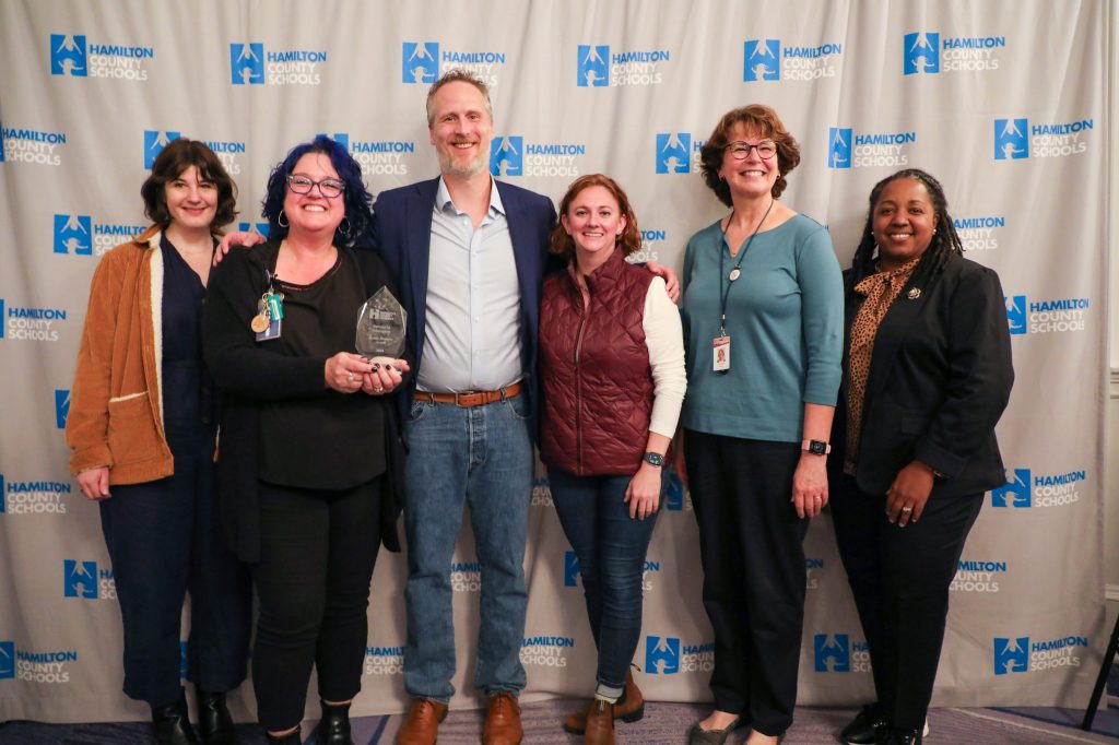 A group poses for a photo