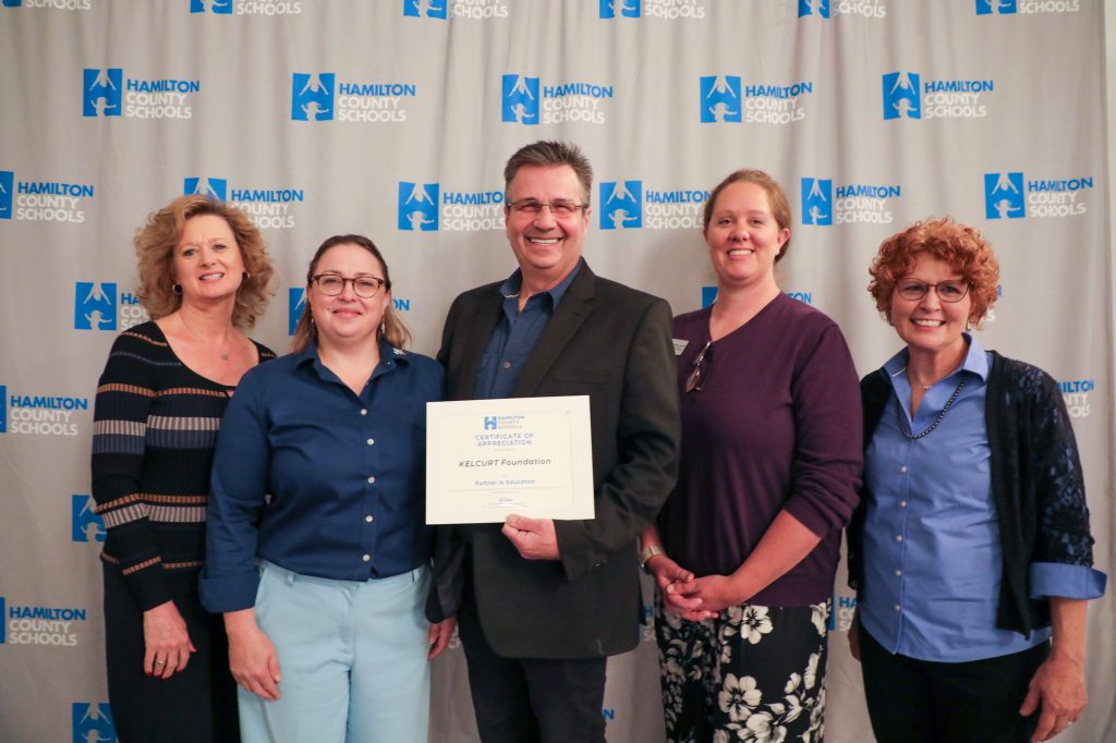 A group poses for a photo
