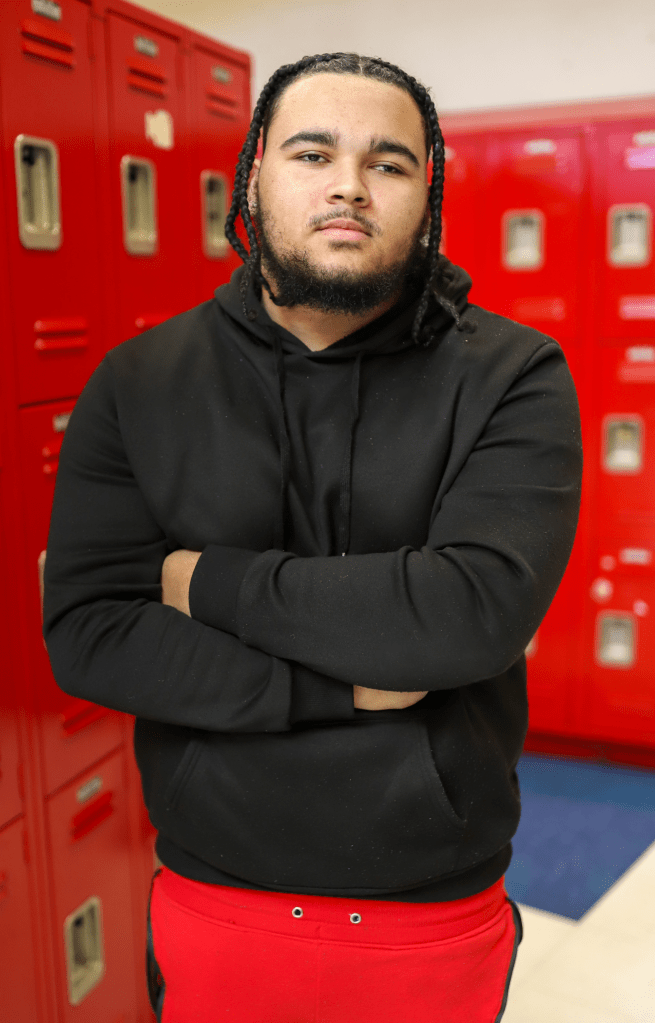 2_1f639a A student poses for a photo