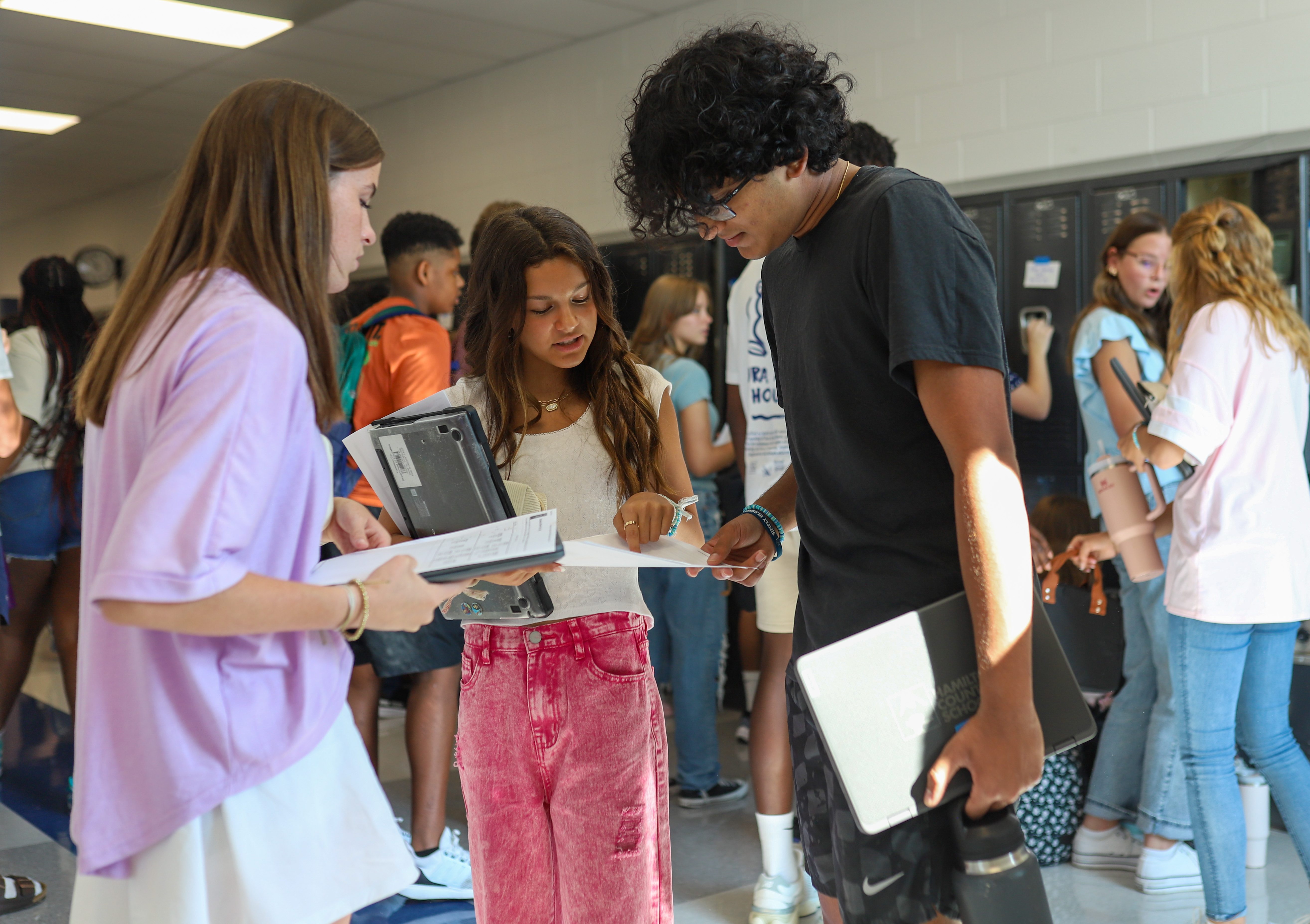 Students look at their schedules