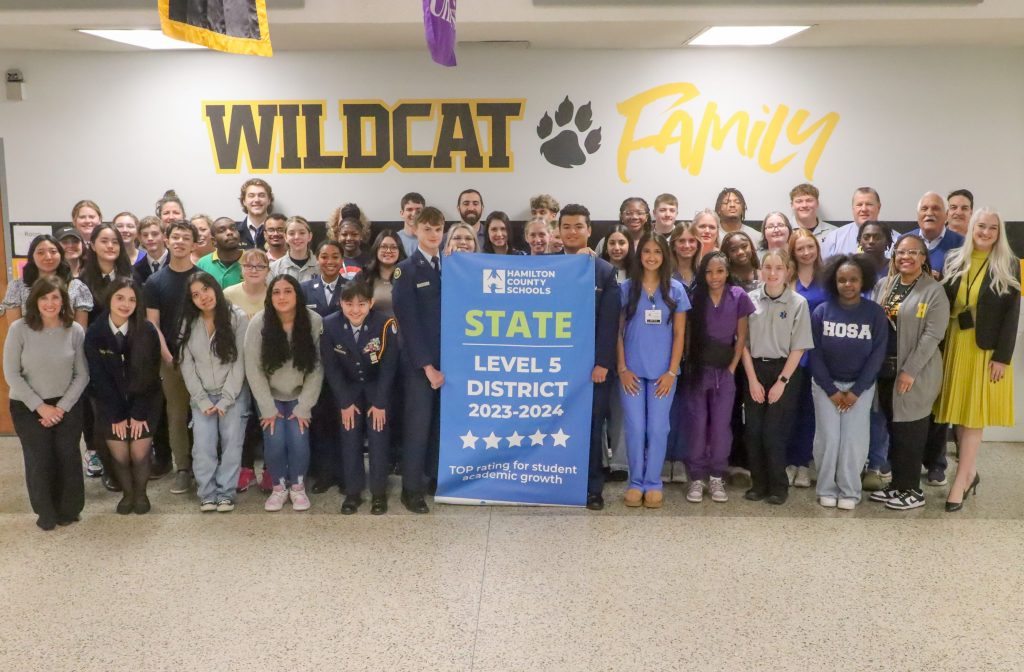 Hixson High - Level 5 Students pose for a banner presentation photo
