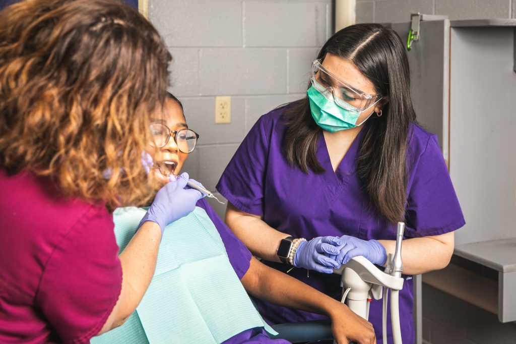 HixsonHigh_30 students practice dental exam