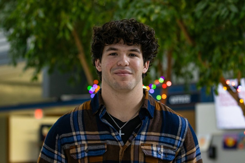 A student poses for a photo