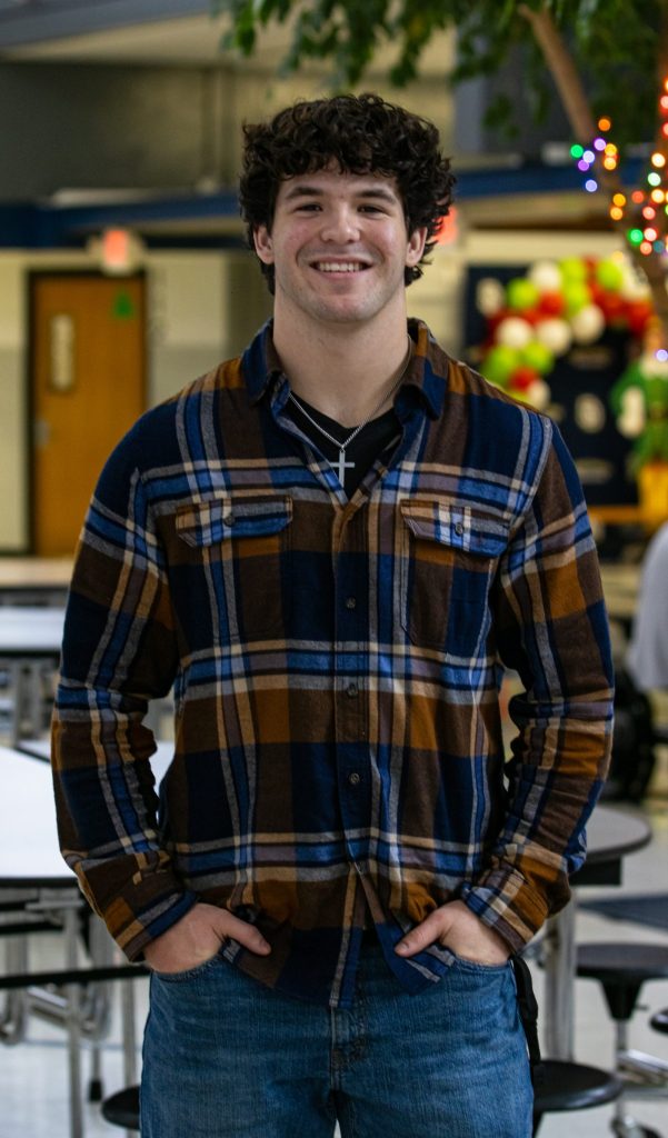 A student poses for a photo