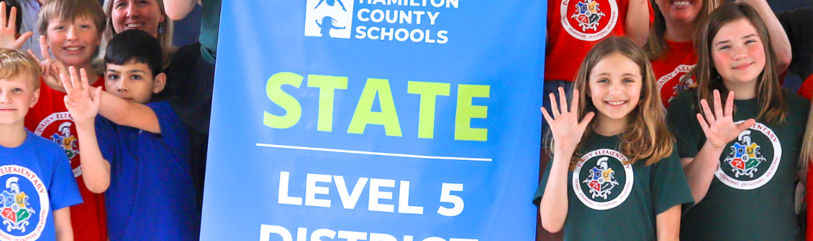 Students pose for a banner presentation photo