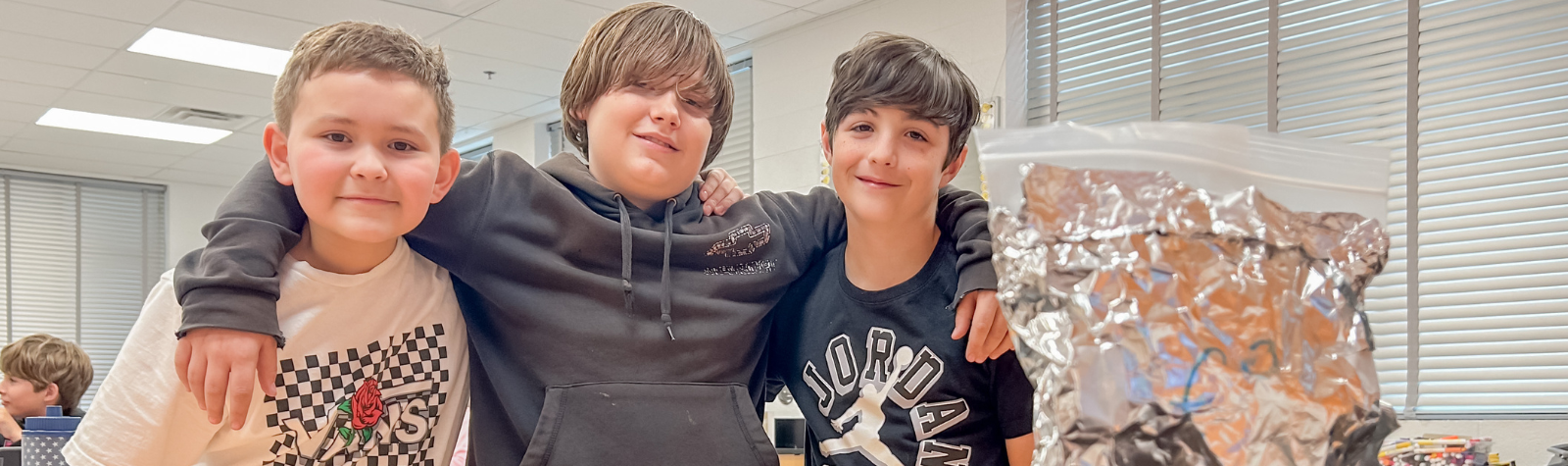 Middle School kids showing science project