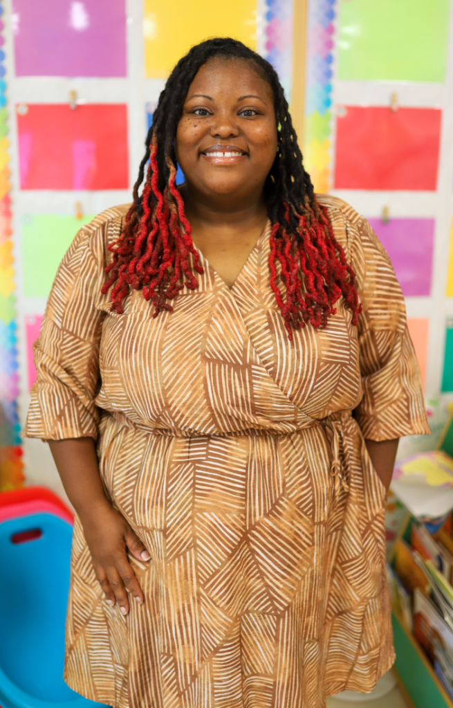 NEWSROOM COVER - Storybook Trail-20 A teacher poses for a photo