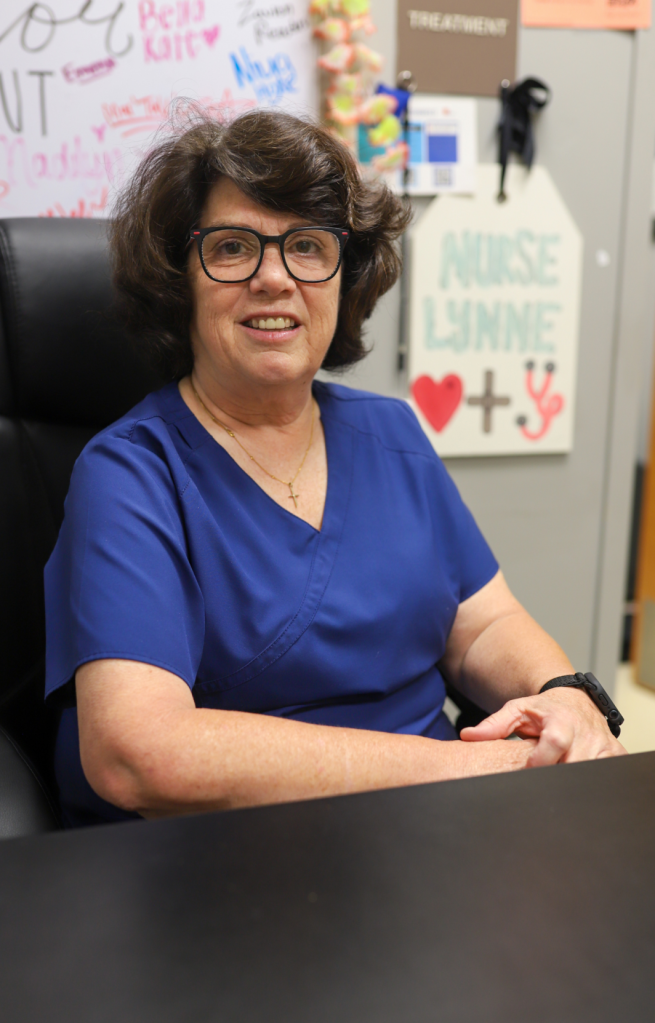 NEWSROOM COVER - Storybook Trail-22 A nurse poses for a photo