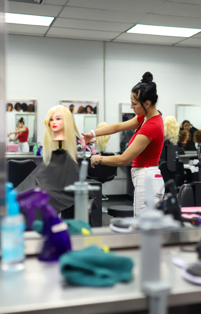 NEWSROOM COVER - Storybook Trail-8 A cosmotology student works