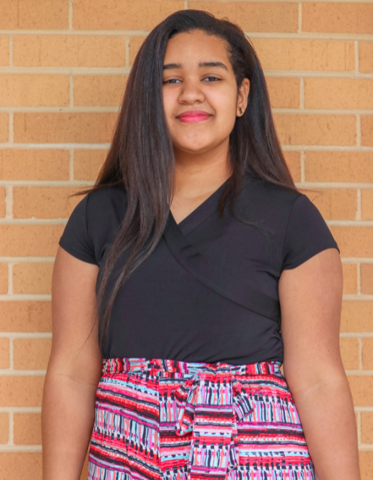 A student smiles for a photo