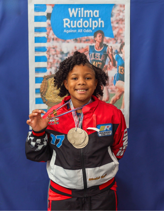 A student poses for a photo