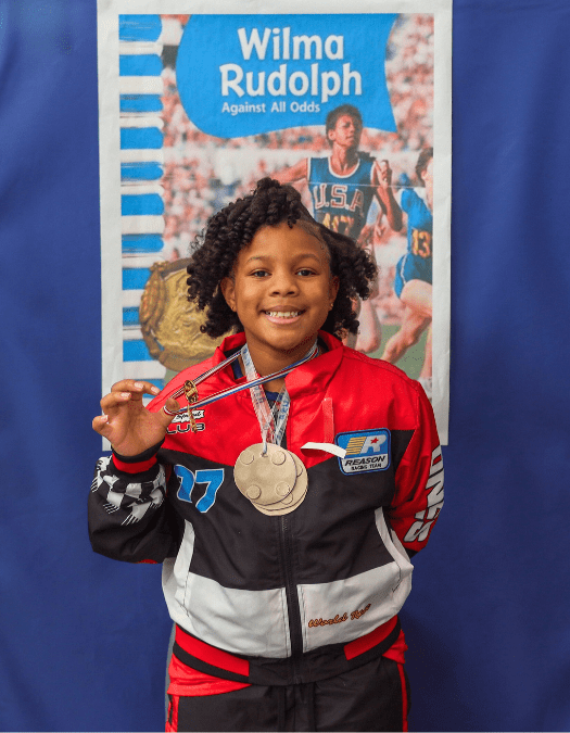 A student poses for a photo