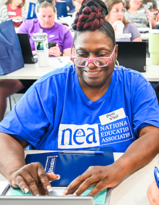 A woman works on a computer