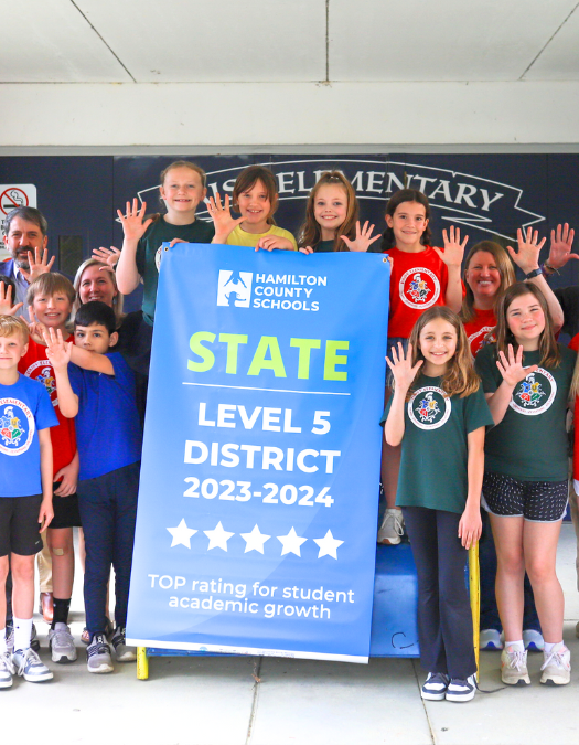Students pose for a banner presentation photo