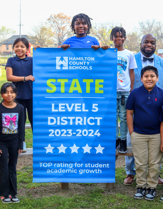 Students pose for a banner presentation photo