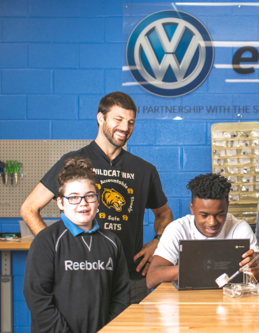 students and teacher in Volkswagen classroom