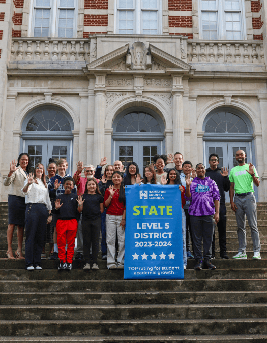 Students pose for a banner presentation photo