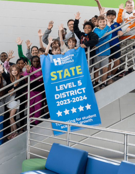 Students pose for a banner presentation photo