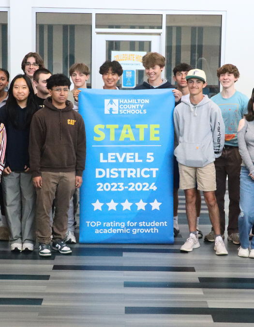 Students pose for a banner presentation photo