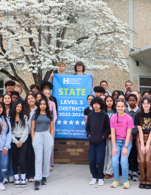 Students pose for a banner presentation photo