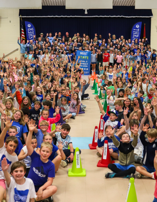 Students pose for a banner presentation photo