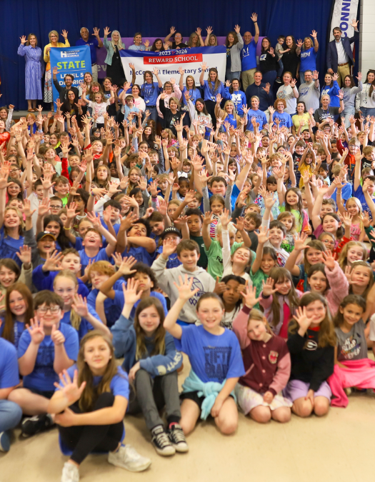Students pose for a banner presentation photo