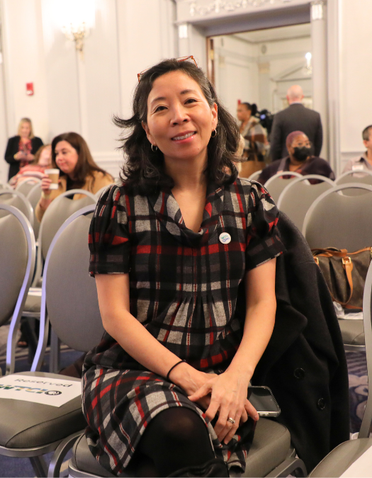 A woman poses for a photo