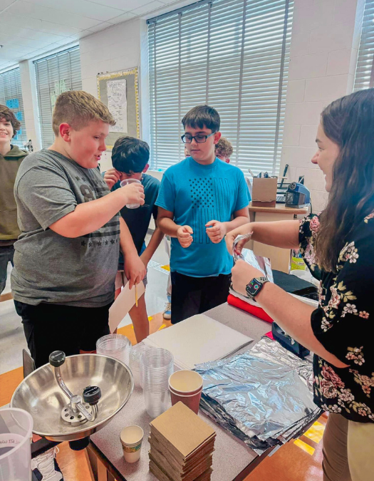 Middle School kid working on science project