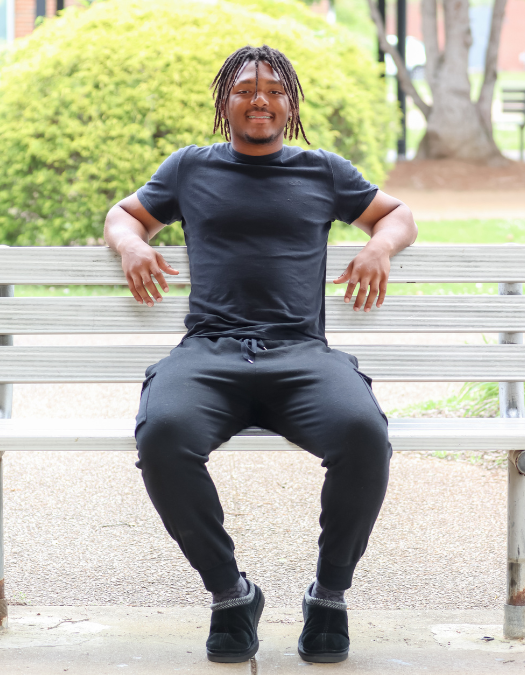 A student poses for a photo