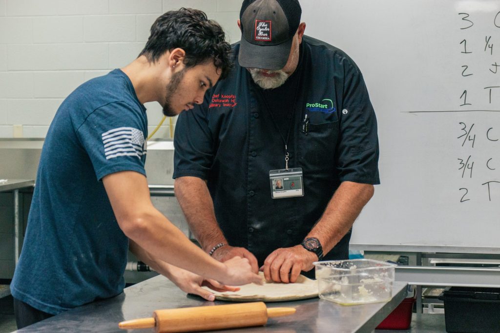 OHS 9.11.24-15 Student and teacher making pizza / bread , Ooltewah High culinary pathway