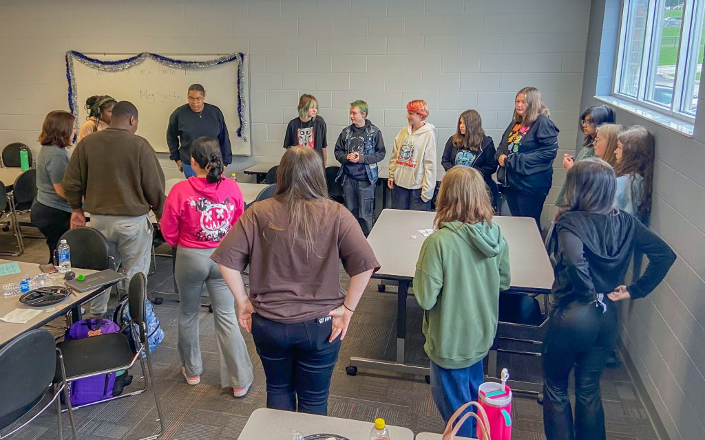 RBH Mental Health Week-16 students stand around in circle in classroom at red bank high