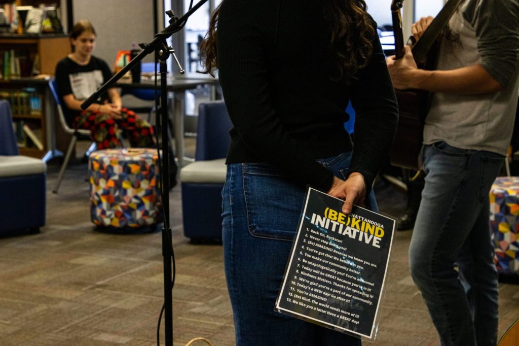 RBHS Mental Health Awareness Week person holding the Be Kind initiative flyer