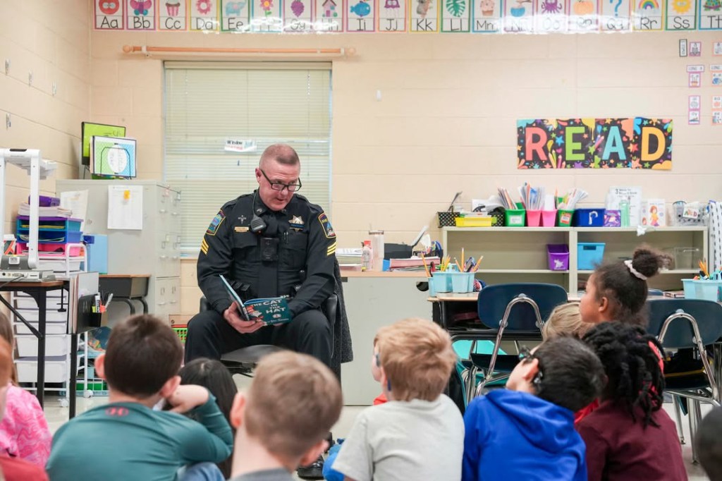 Read Across America Edited An officer reads to a class