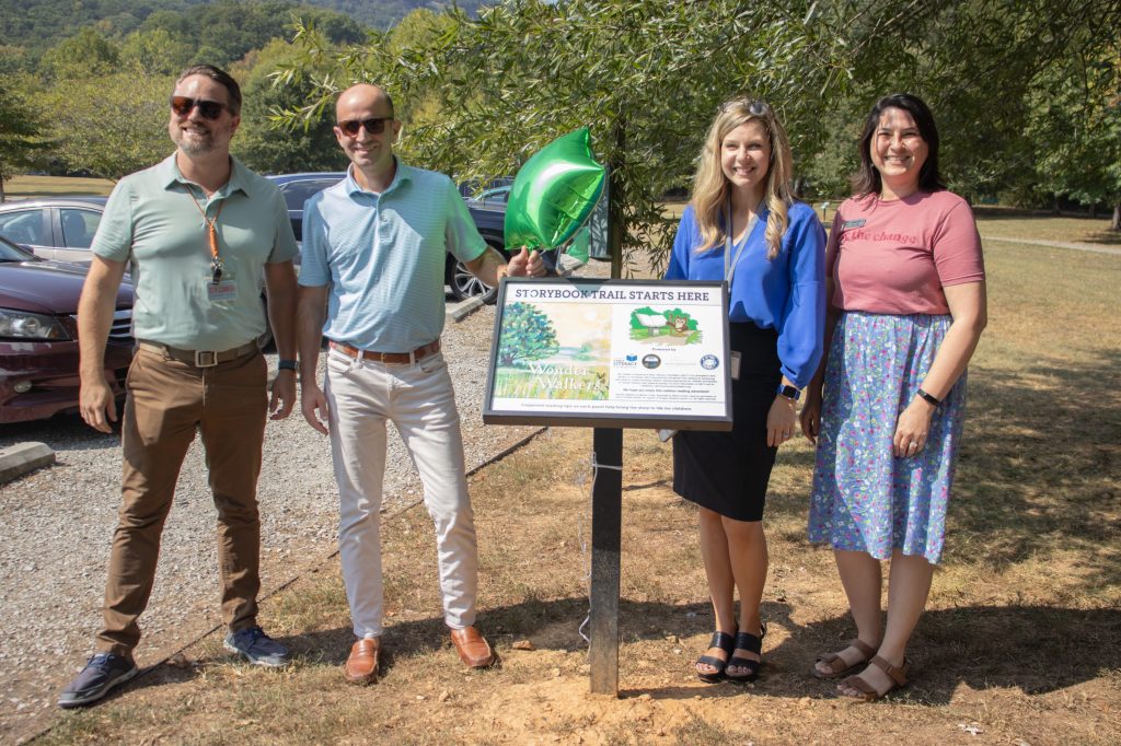 Storybook Trail 8.29.24-1 A group smiles for a photo