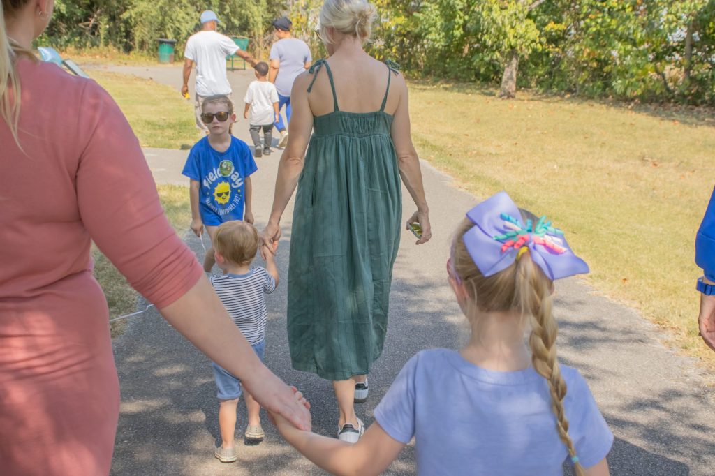 Storybook Trail 8.29.24-10 A group walks outside