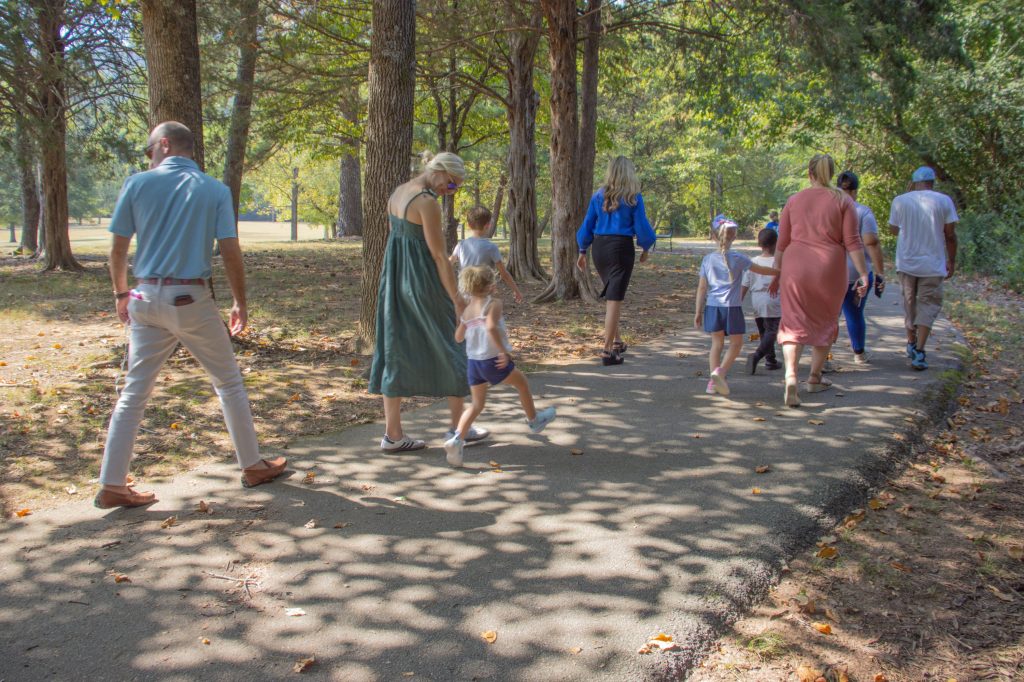 Storybook Trail 8.29.24-14 A group walks outside