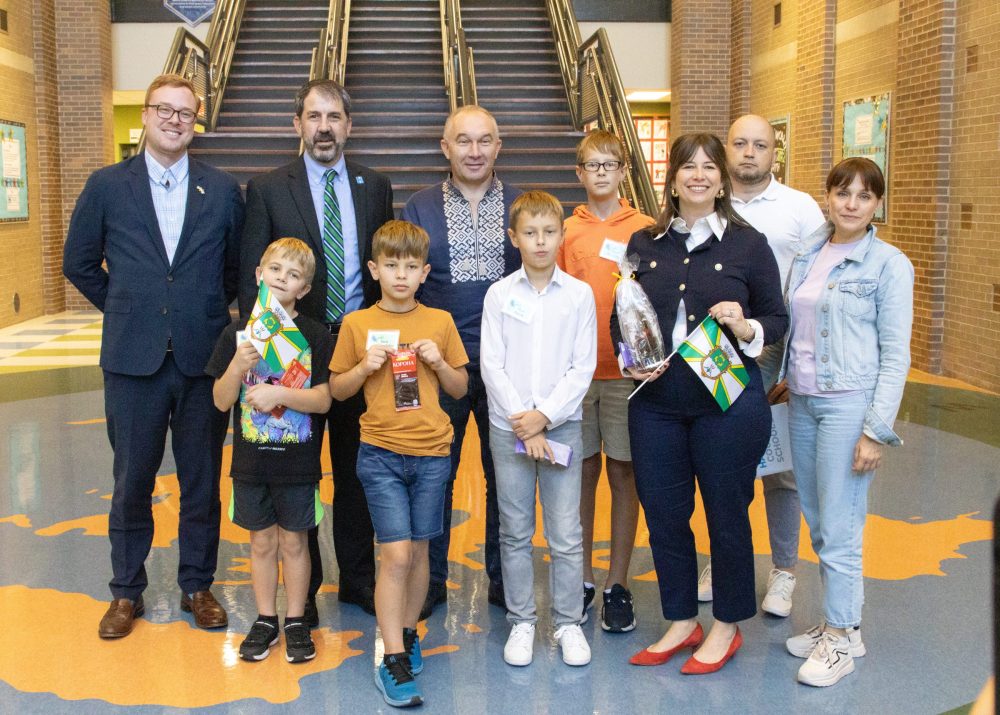 Ukraine Delegate Visits EBE-22 Mayor and Dr. Robertson and kids and principal pose for group photo during East Brainerd Elementary Ukraine Mayor Visit