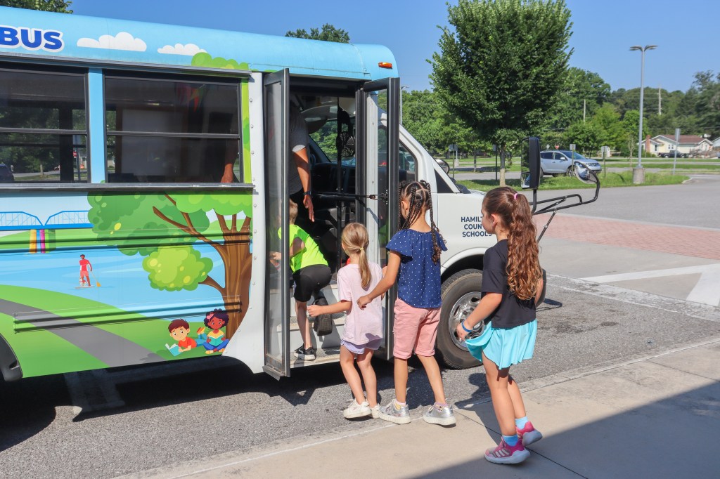 Book Bus Summer Reach MVE-15 students getting on book bus