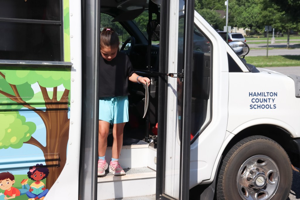 Book Bus Summer Reach MVE-16 student on book bus