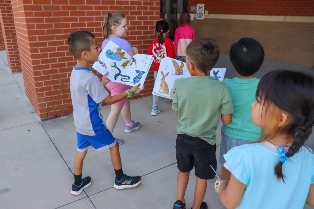 Book Bus Summer Reach MVE-19 student reading book