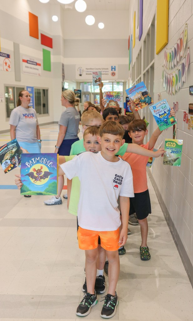 Book Bus Summer Reach MVE-22 students holding books