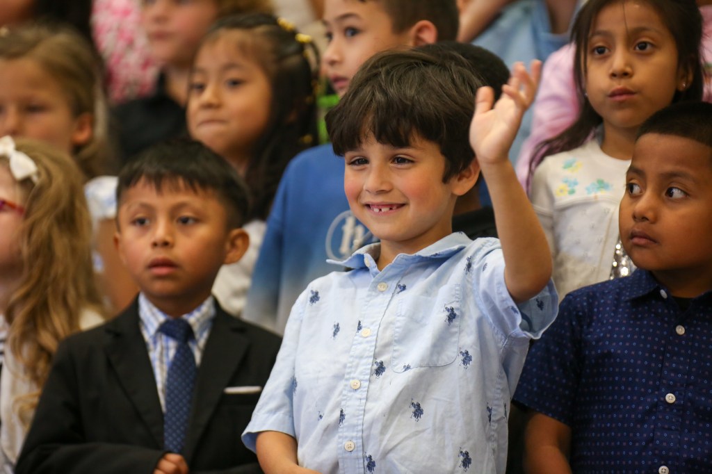 kindergarten, graduation, singing, stage, first year teacher, hug, group photo